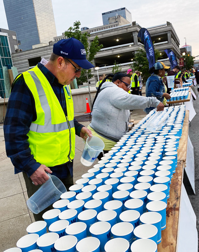 filling cups at 3rd street for mini-marathon