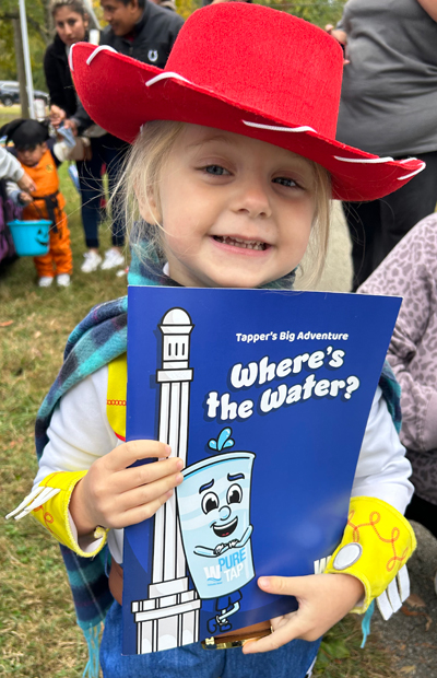 Kid in costume with LWT book