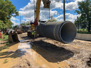 Louisville Water crew with replacement pipe