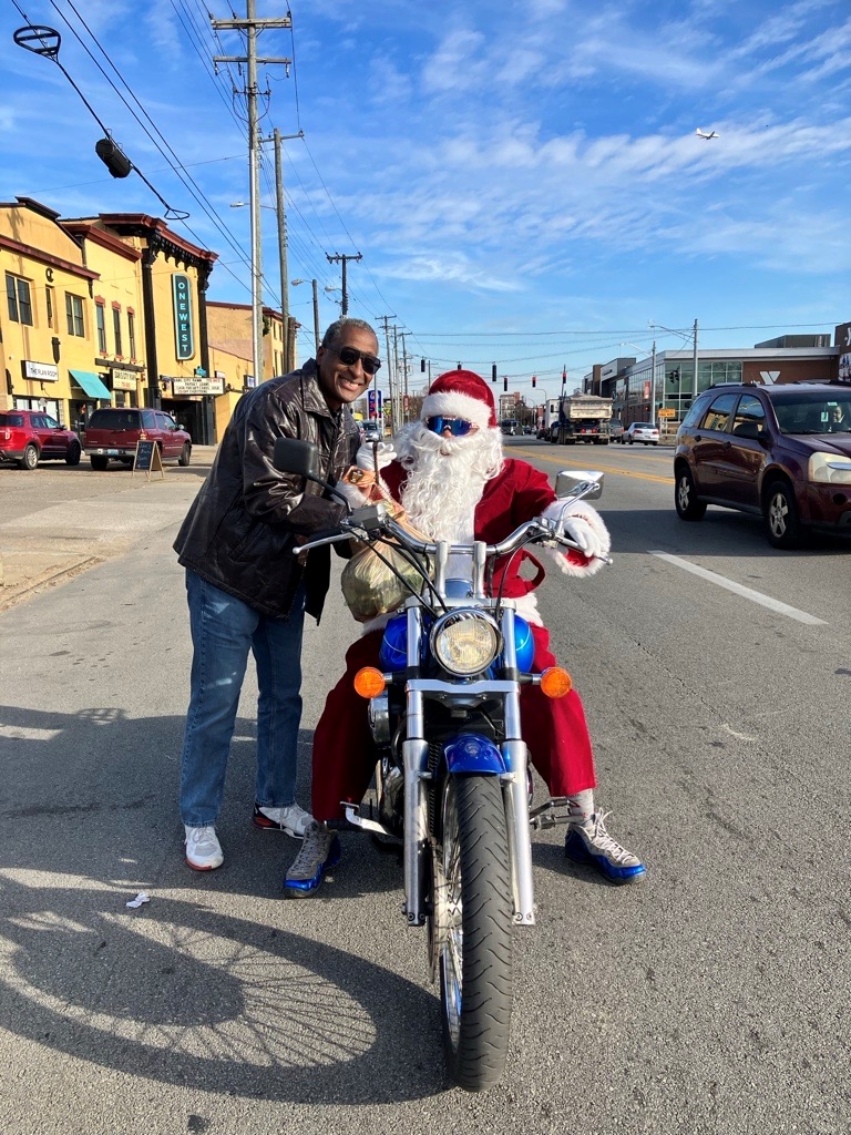 Lou Water - VP Spence gives Santa a ham RESIZE West Louisville -VP Terrence Spence gives Santa a ham