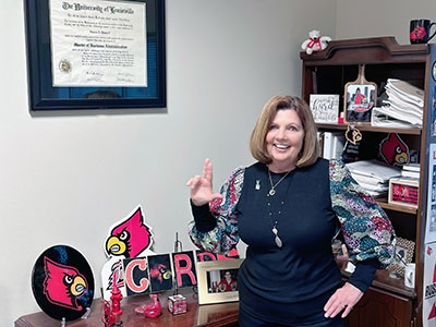 Sue Purdy with UofL collectables