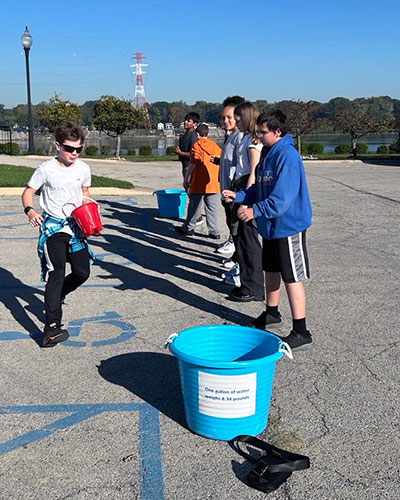 Eminence students bucket brigade