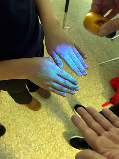 Handwashing week backlit on hands