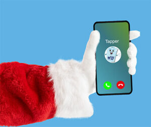 Santa holding a phone with Tapper