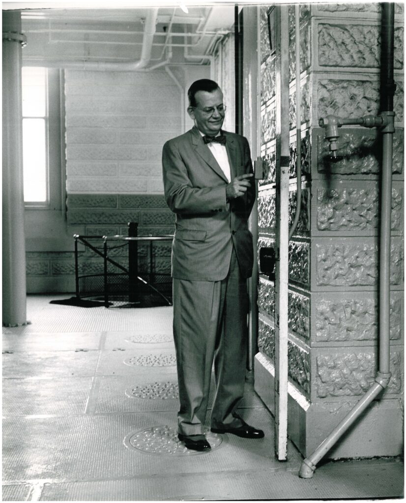 B.E. Payne points to the 1937 flood marker at Louisville Water's pumping station.