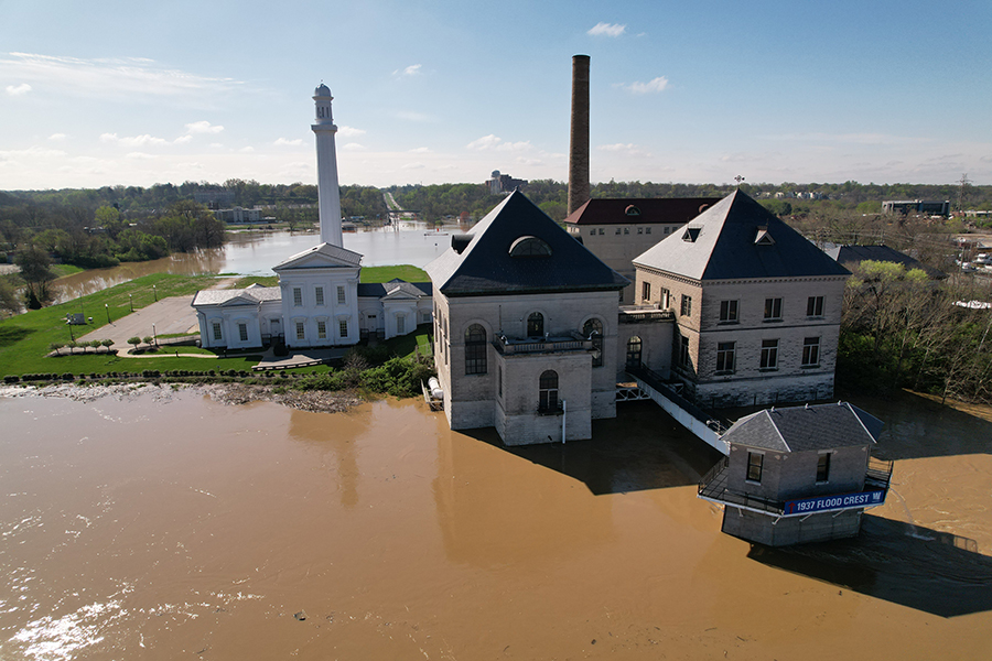 Aerial view of flooding in April 2025 shows the historical 1937 flood crest marker on Louisville Water's screen tower.