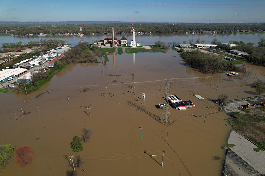 Aerial view of flooding in April 2025 shows water covering River Road and Zorn Avenue, including homes and businesses.