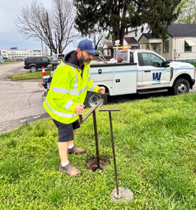 Crew member checking water source