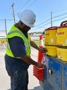 Crew worker getting a drink of water