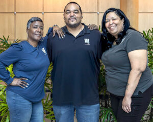 image - Olivia standing with co-workers