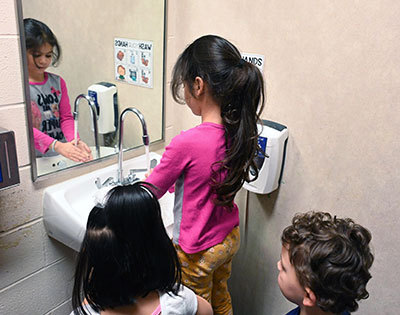 Students washing hands