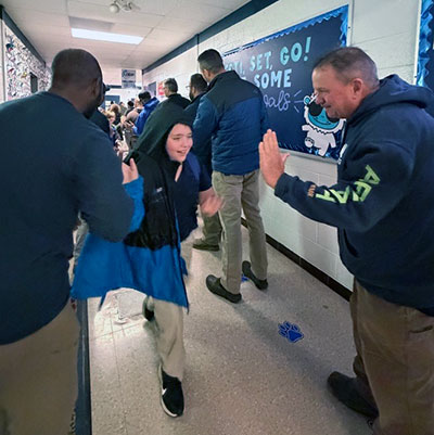 Flash Dads giving high-fives
