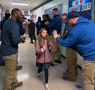 Flash Dads giving high fives