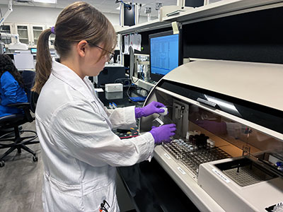 Casey LaFollette working in lab