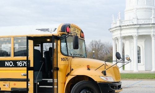 Bus in front of Louisville Water tower