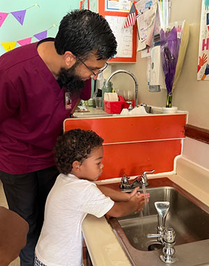 Qadir with preschooler