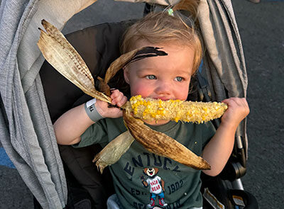 Ella eating corn