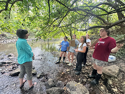 Bellarmine biology students in creek