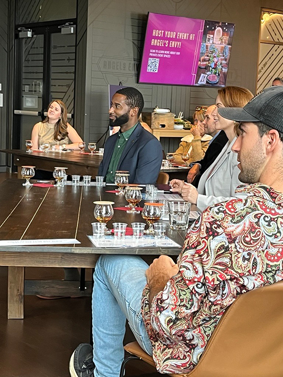 Guests participate in water and bourbon tasting
